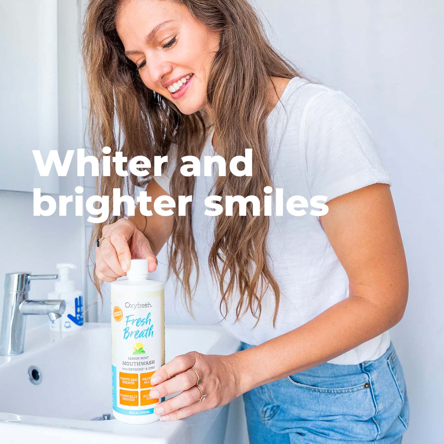 oxyfresh lemon mint mouthwash being opened by woman
